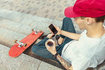 Image showing Skateboarder at the city\'s street in sunny day