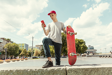 Image showing Skateboarder at the city\'s street in sunny day