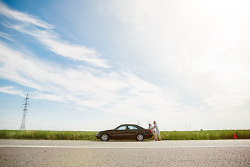 Image showing Young lesbian\'s couple going to vacation trip on the car in sunny day