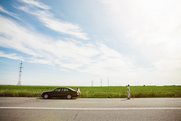 Image showing Young lesbian\'s couple going to vacation trip on the car in sunny day