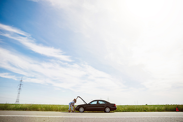 Image showing Young lesbian\'s couple going to vacation trip on the car in sunny day