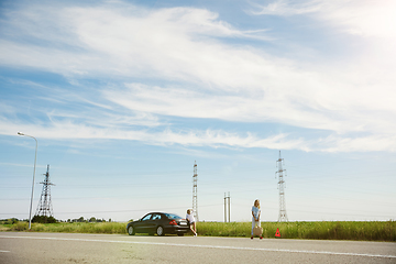 Image showing Young lesbian\'s couple going to vacation trip on the car in sunny day