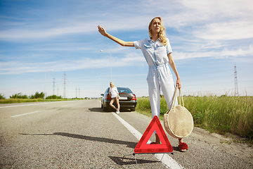 Image showing Young lesbian\'s couple going to vacation trip on the car in sunny day