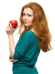 Image showing Young happy girl with apple