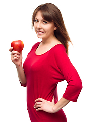 Image showing Young happy girl with apple