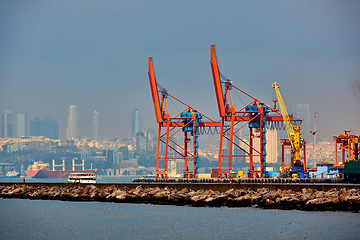 Image showing Logistics and transportation of Container Cargo ship and Cargo plane with working crane bridge in shipyard, logistic import export and transport industry background