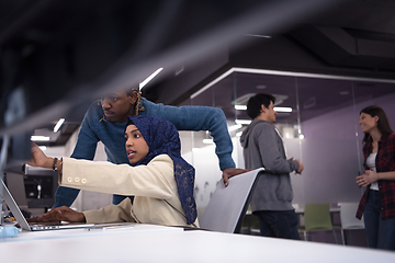 Image showing young black muslim female software developer at work