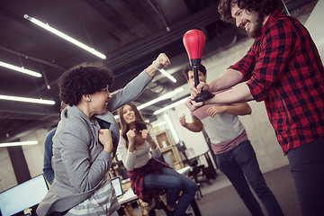 Image showing multiethnics business team boxing at office