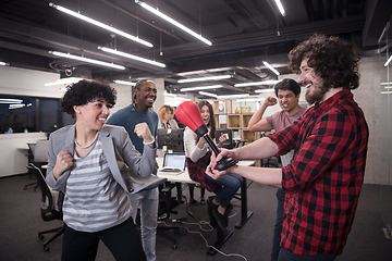 Image showing multiethnics business team boxing at office