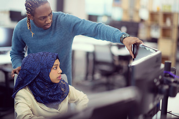 Image showing young black muslim female software developer at work