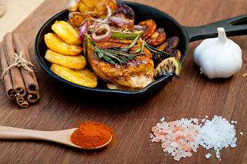 Image showing roasted grilled BBQ chicken breast with herbs and spices 