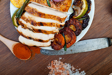 Image showing roasted grilled BBQ chicken breast with herbs and spices 