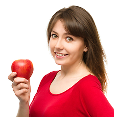 Image showing Young happy girl with apple