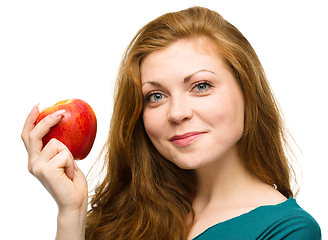 Image showing Young happy girl with apple