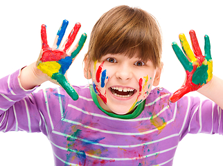 Image showing Portrait of a cute girl playing with paints