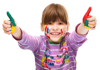 Image showing Portrait of a cute girl playing with paints