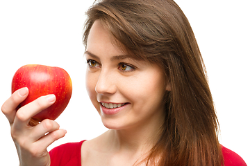 Image showing Young happy girl with apple