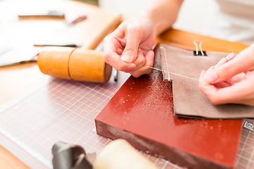 Image showing Working process of the leather wallet in the leather workshop