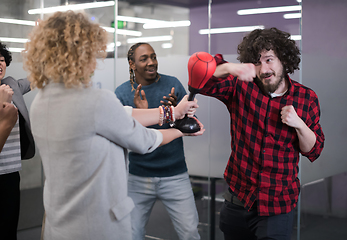 Image showing multiethnics business team boxing at office