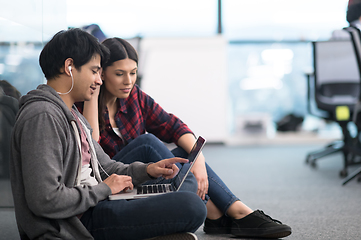 Image showing software developers couple working on the floor