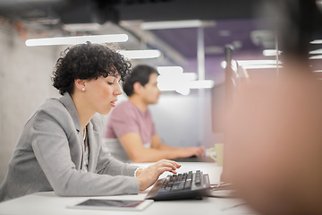 Image showing female software developer using desktop computer