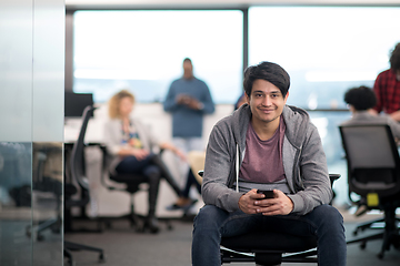 Image showing software developer using mobile phone