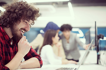 Image showing young multiethnics team of software developers working together