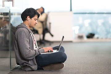 Image showing software developer working on the floor