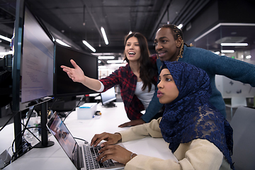 Image showing multiethnics team of software developers working together