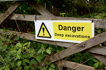 Image showing Warning sign - Danger Deep Excavations - on a wooden gate