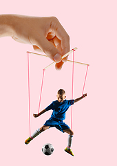 Image showing Boy like a puppet in somebodies hands. Concept of manipulation