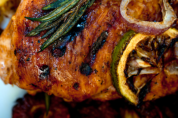 Image showing roasted grilled BBQ chicken breast with herbs and spices 