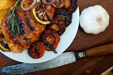 Image showing roasted grilled BBQ chicken breast with herbs and spices 