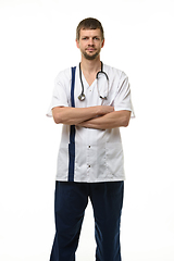 Image showing Man showing doctor\'s clothes, front view, isolated on white background