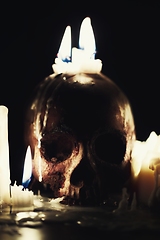 Image showing Human skull in candle light closeup