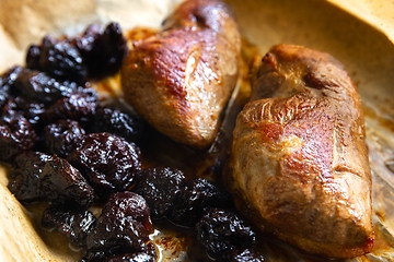 Image showing Roast duck breast with plums prepared closeup