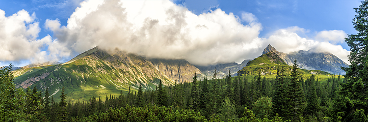 Image showing Polish Tatra mountains summer landscape with blue sky and white clouds.