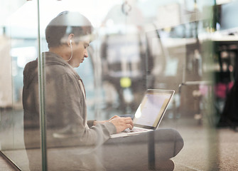 Image showing software developer working on the floor