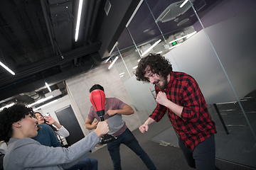 Image showing multiethnics business team boxing at office