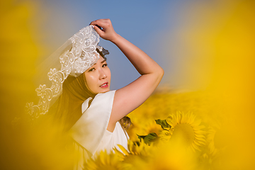 Image showing asian woman at sunflower field