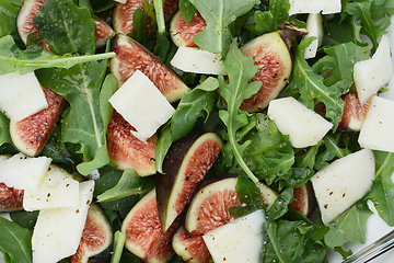 Image showing Fresh figs, pecorino cheese and green rocket