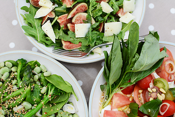 Image showing Delicious fresh salads on a table