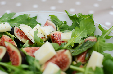 Image showing Fresh fig salad with pecorino and rocket leaves