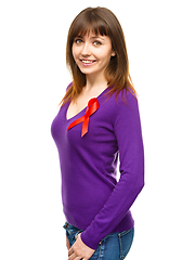 Image showing Woman with the red awareness ribbon