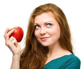 Image showing Young happy girl with apple