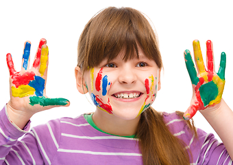 Image showing Portrait of a cute girl playing with paints