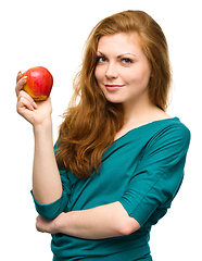 Image showing Young happy girl with apple