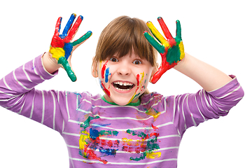 Image showing Portrait of a cute girl playing with paints