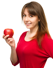 Image showing Young happy girl with apple