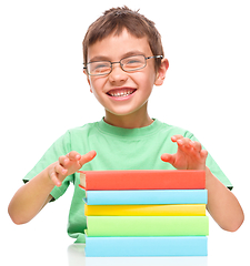 Image showing Little boy is reading a book